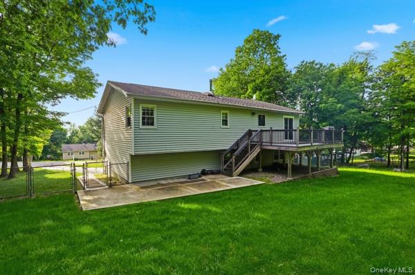 31 Laura Road Monroe, NY 10950 - Photo 4 of 39 a view of a backyard with a garden and trees