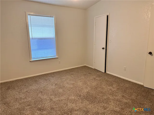 an empty room with a bench