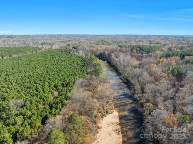 a view of a field with a mountain in the background