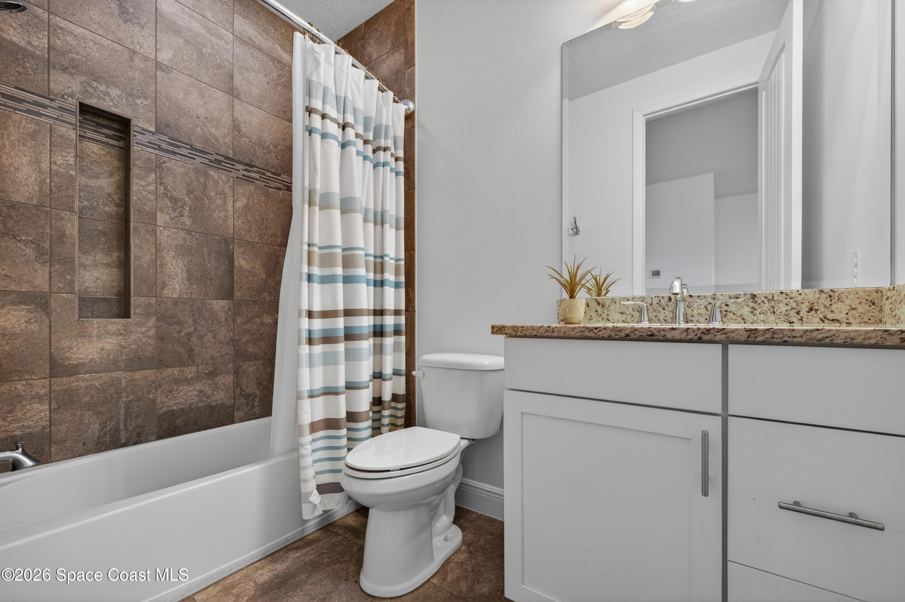 2343 Rodina Drive Melbourne, FL 32940 - Photo 14 of 72 a bathroom with a sink toilet and shower