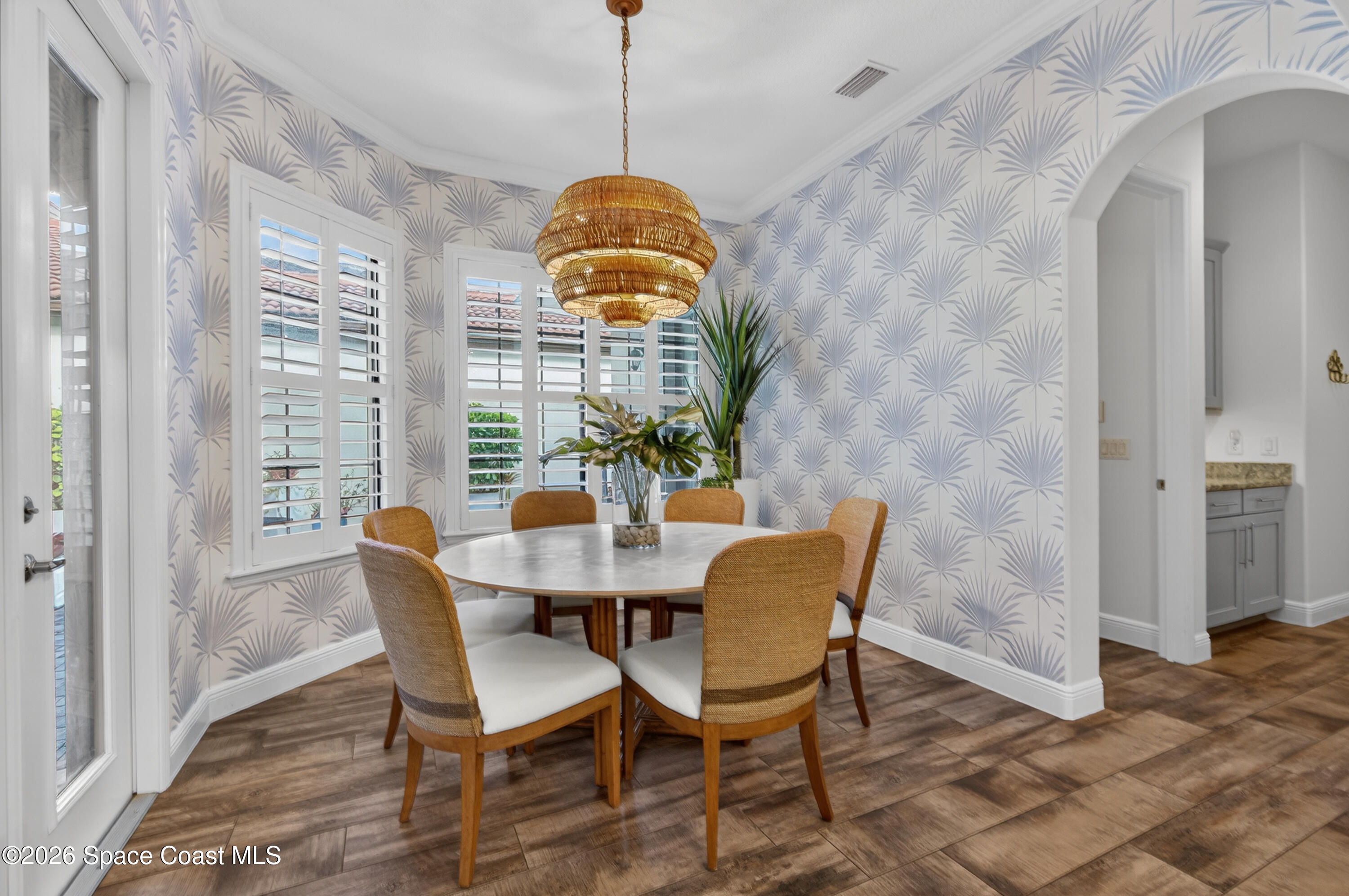 2343 Rodina Drive Melbourne, FL 32940 - Photo 3 of 72 a view of a dining room with furniture window and wooden floor