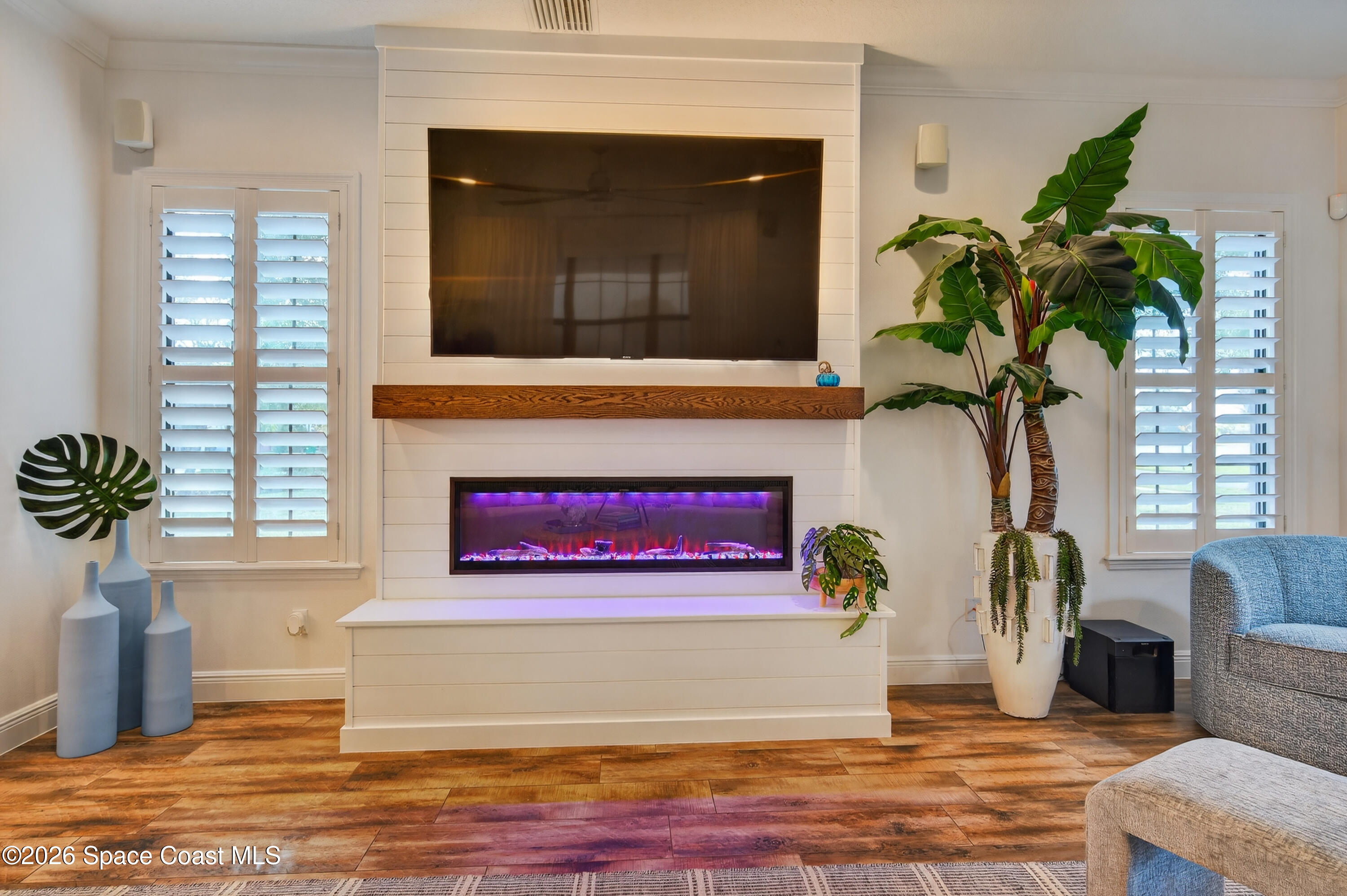 2343 Rodina Drive Melbourne, FL 32940 - Photo 67 of 72 a living room with furniture and a potted plant