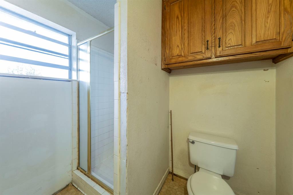 1202 Panorama Loop Waxahachie, TX 75165 - Photo 14 of 26 Bathroom with a stall shower and toilet