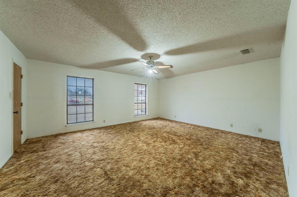 1202 Panorama Loop Waxahachie, TX 75165 - Photo 10 of 26 Empty room featuring carpet flooring and a textured ceiling