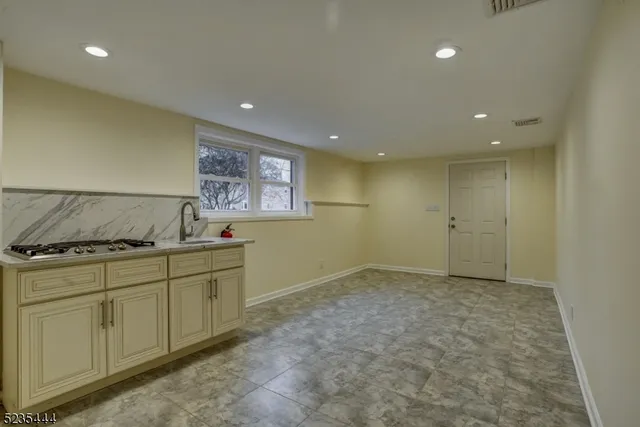 a kitchen with white cabinets