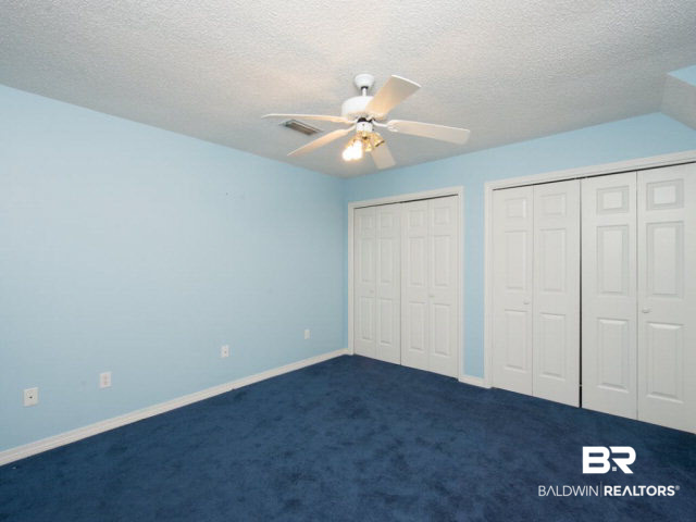 18700 East River Road South Silverhill, AL 36576 - Photo 24 of 32 Large upstairs bedrooms feature joined bathroom