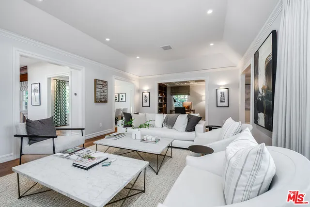 a view of a dining room with furniture and a window