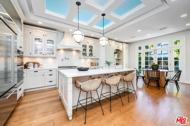 a large white bed in a white room
