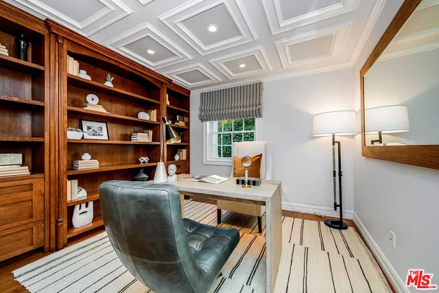 a white bath tub sitting next to a white chair