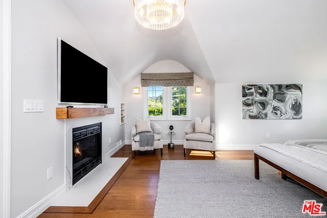 a view of a gym room with windows and lounge chair