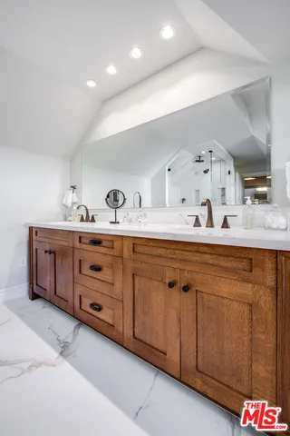 a living room with large windows and wooden floor