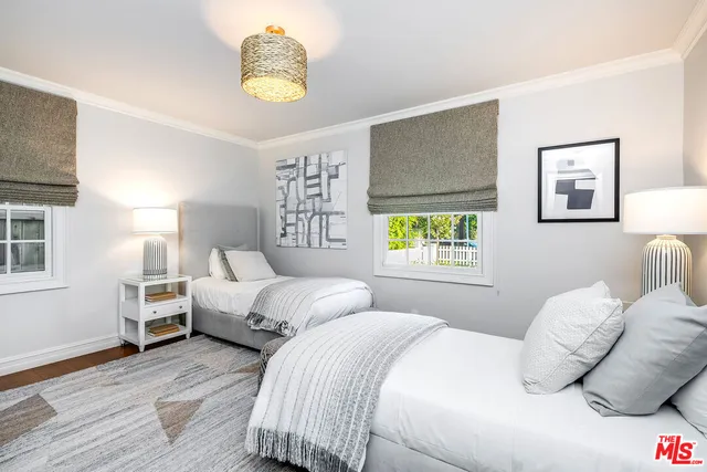 an aerial view of a house with a swimming pool