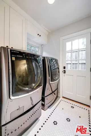 a view of a house with swimming pool and sitting area