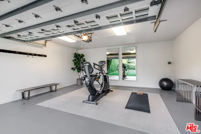 a view of a house with swimming pool and sitting area