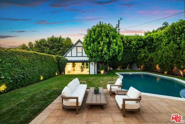 a view of a chairs and a table in a room