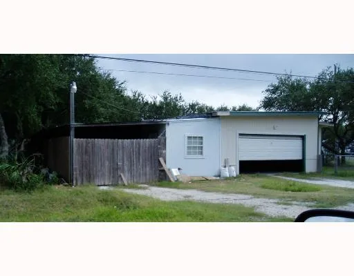 a view of a yard with an outdoor space
