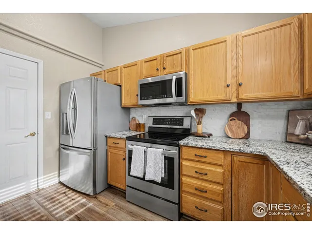 a view of a kitchen from a hallway