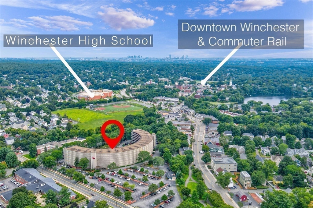 200 Swanton Street, Unit T28 Winchester, MA 01890 - Photo 32 of 34 a view of outdoor space with signage and flags