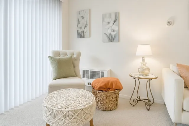 a bedroom with bed and a chandelier