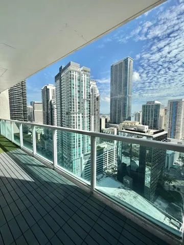 a view of balcony with wooden floor