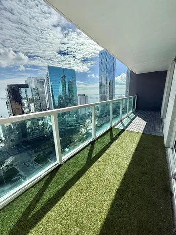 a living room with a table and chairs