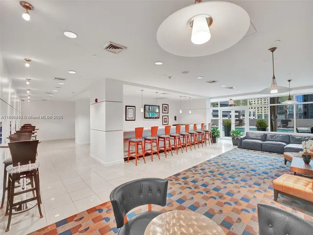 a bedroom with furniture and a rug