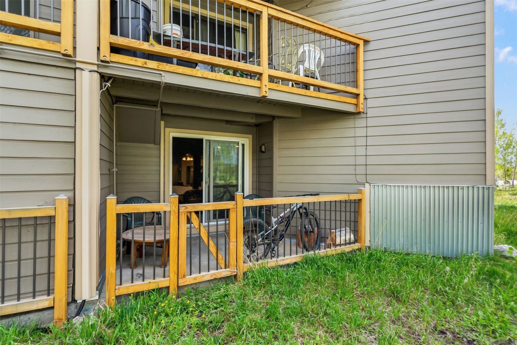 8100 Ryan Gulch Road, Unit 106 Wildernest, CO 80498 - Photo 30 of 43 a view of a house with a yard and balcony