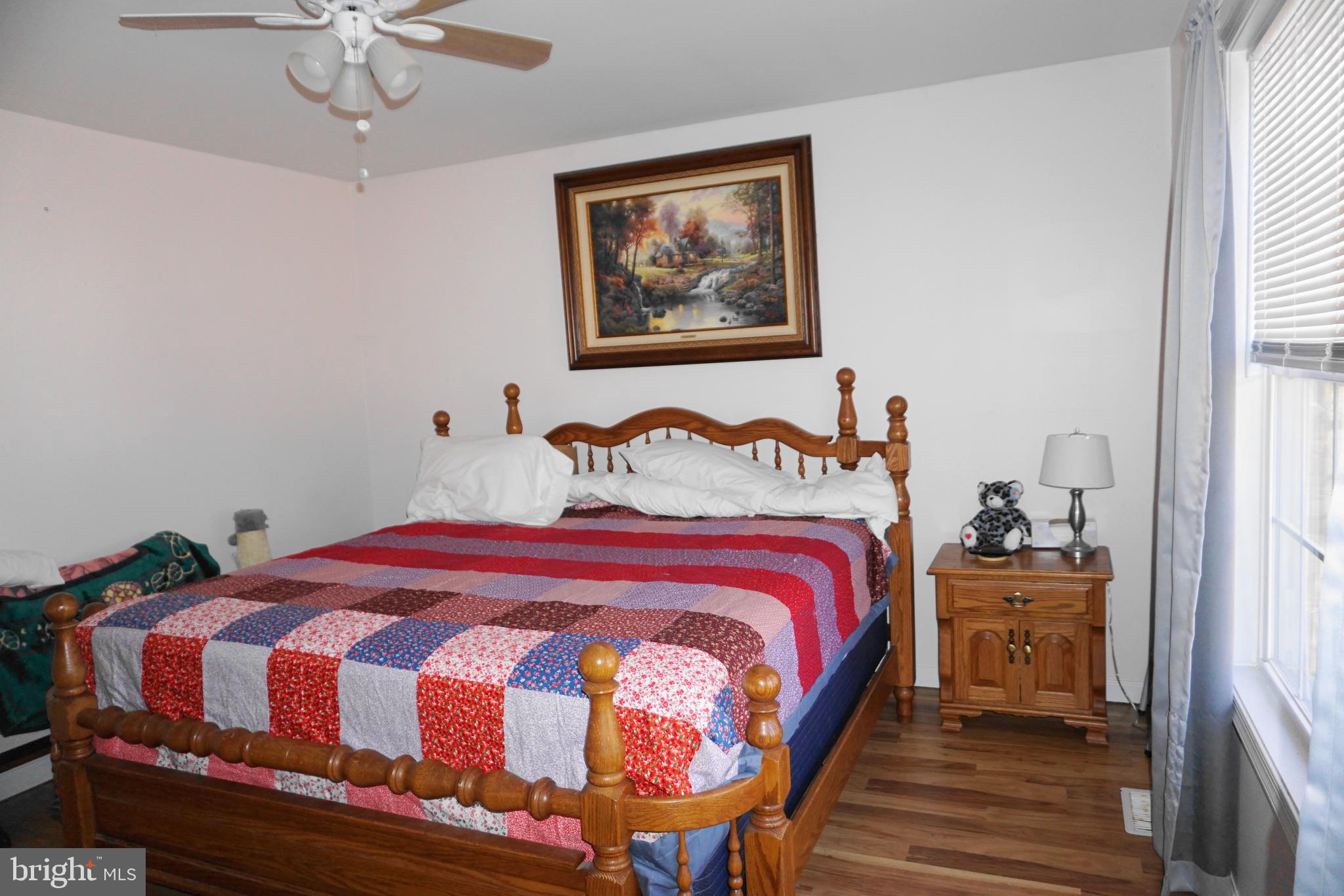 1001 Nottingham Road Elkton, MD 21921 - Photo 13 of 20 a bedroom with a bed and wooden floor