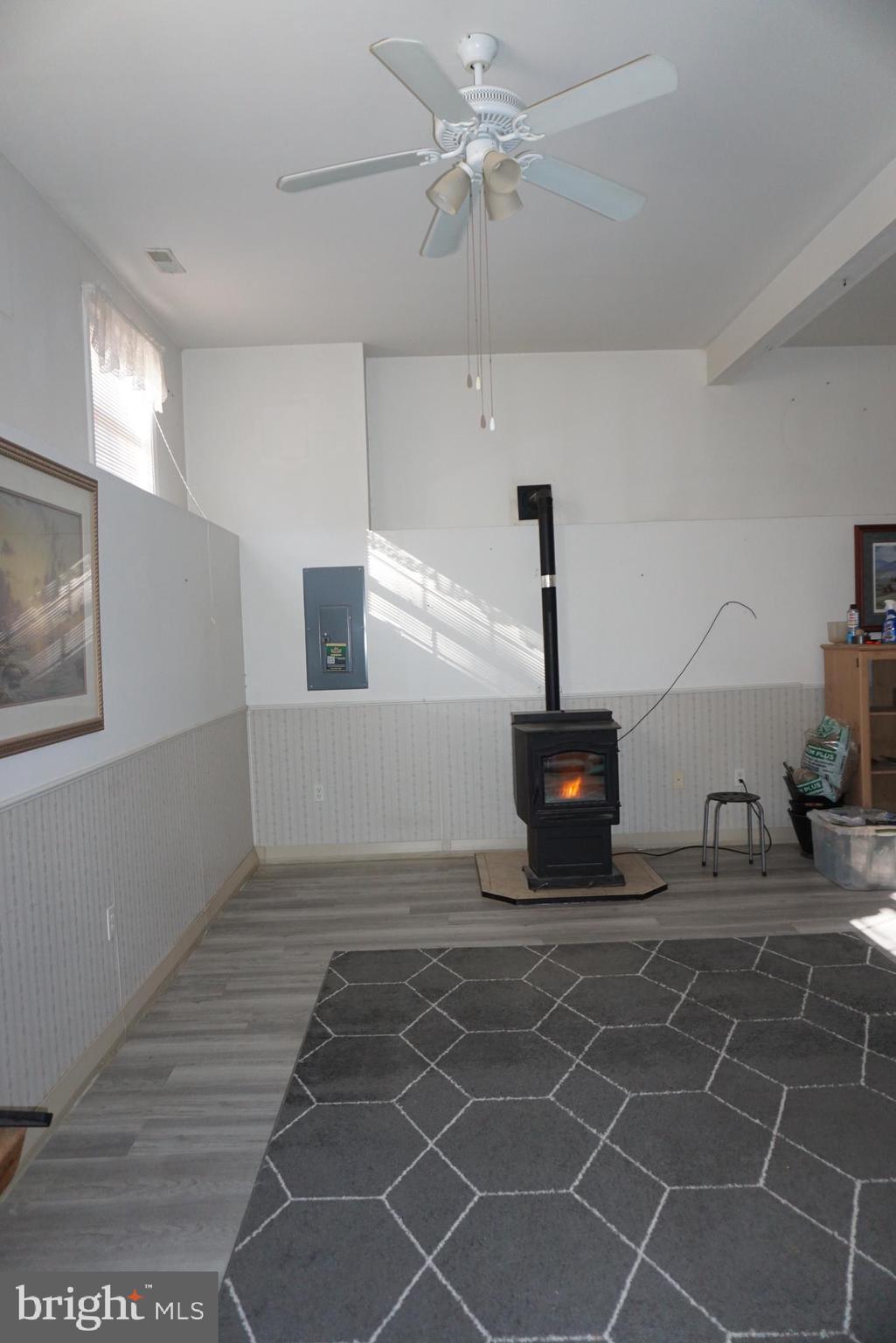 1001 Nottingham Road Elkton, MD 21921 - Photo 17 of 20 a view of a livingroom with wooden floor and a ceiling fan