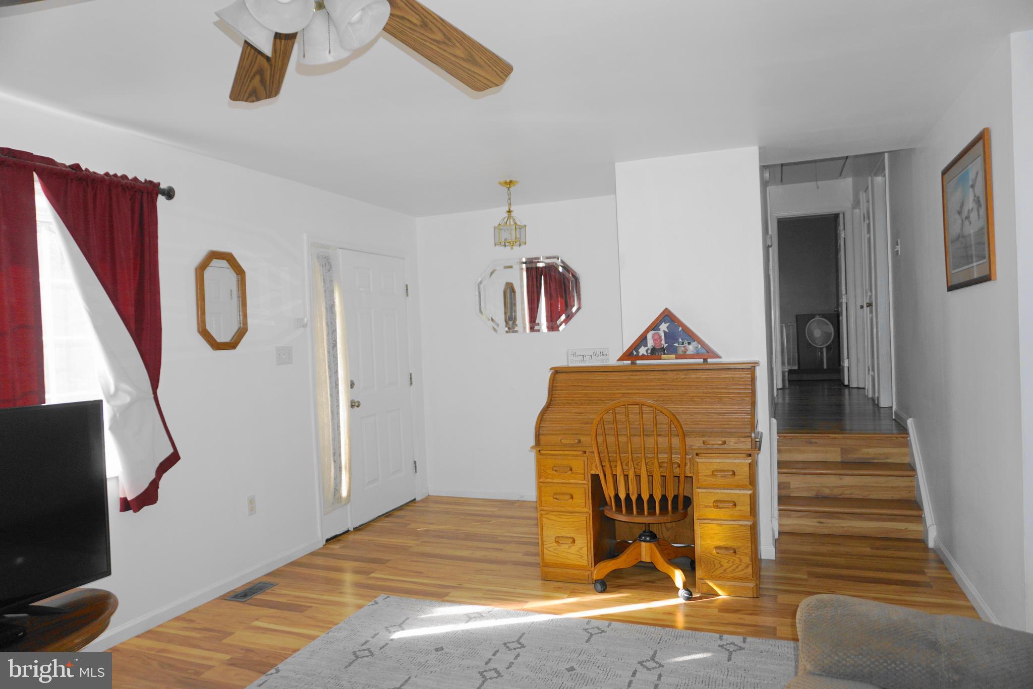 1001 Nottingham Road Elkton, MD 21921 - Photo 8 of 20 a bedroom with a bed and a chandelier