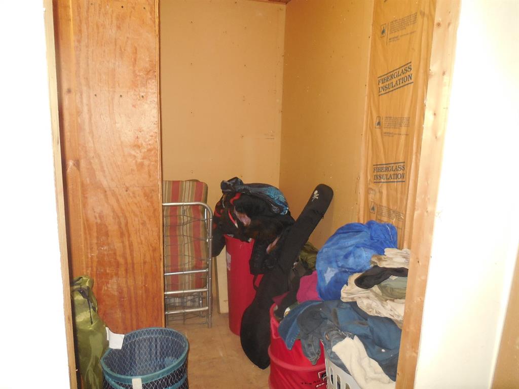 910 Sinclair Street Ranger, TX 76470 - Photo 14 of 21 a living room with furniture and a toilet