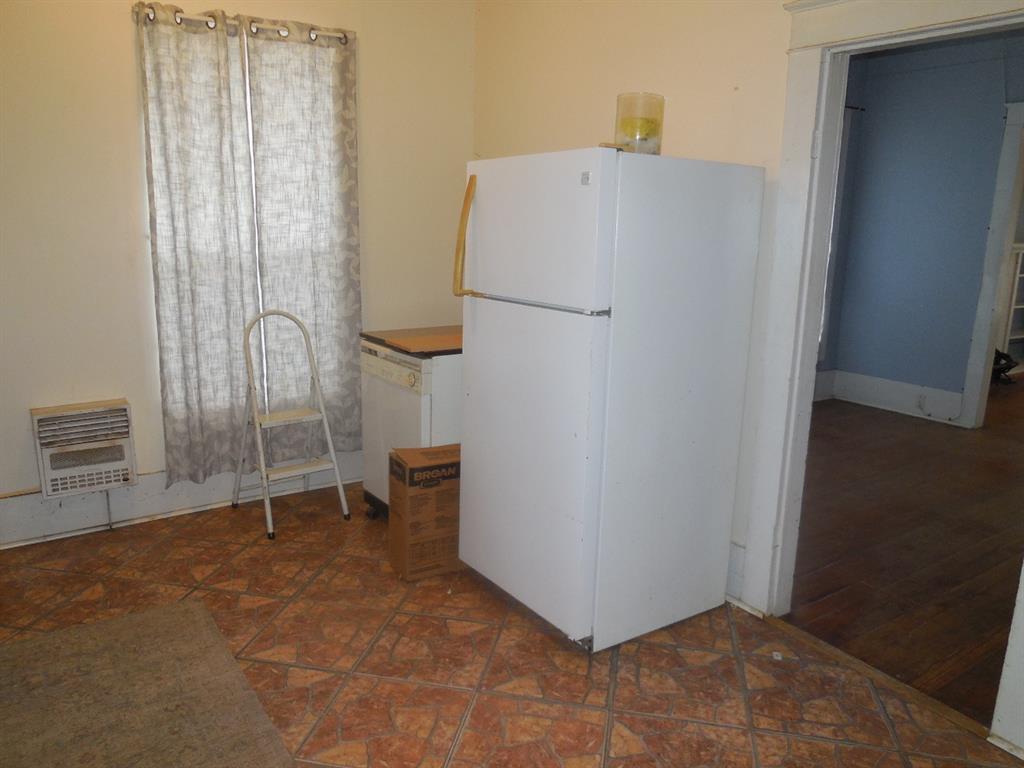 910 Sinclair Street Ranger, TX 76470 - Photo 9 of 21 a view of a storage & utility room with a window