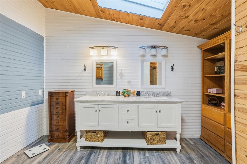 1205 Calvary Road Holiday, FL 34691 - Photo 18 of 34 a bathroom with a sink mirror and vanity