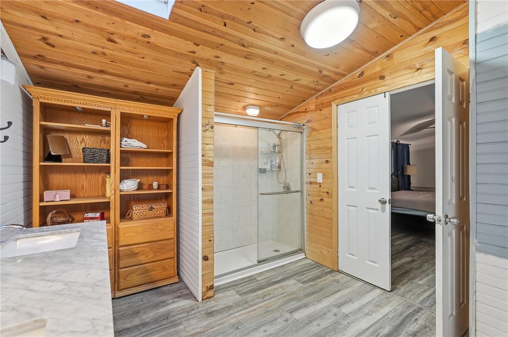 1205 Calvary Road Holiday, FL 34691 - Photo 19 of 34 a view of an empty room and wooden floor