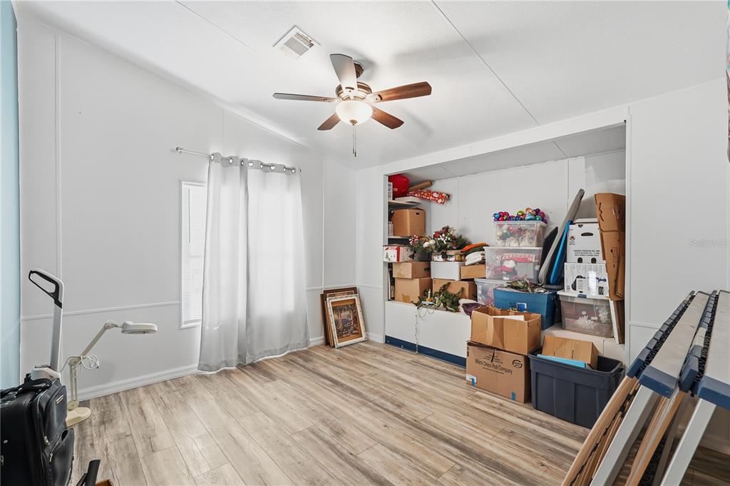 1205 Calvary Road Holiday, FL 34691 - Photo 22 of 34 a view of a livingroom with furniture and a ceiling fan