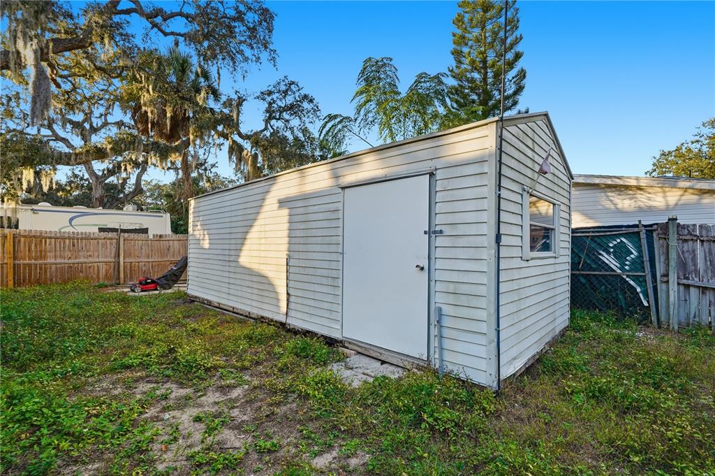 1205 Calvary Road Holiday, FL 34691 - Photo 29 of 34 a view of a house with a yard