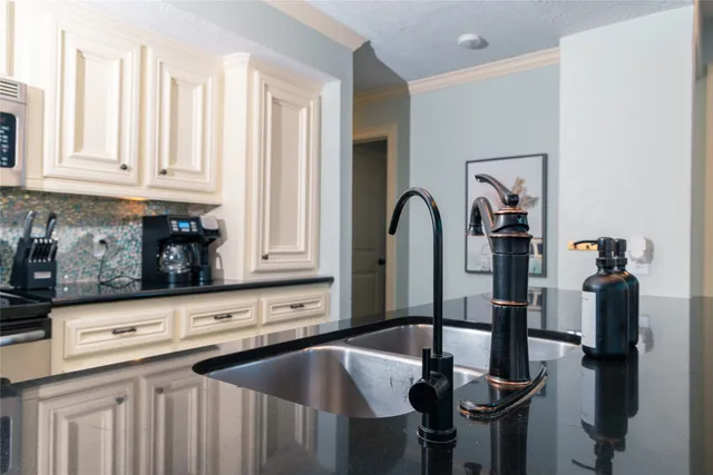 a utility room with cabinets washer and dryer