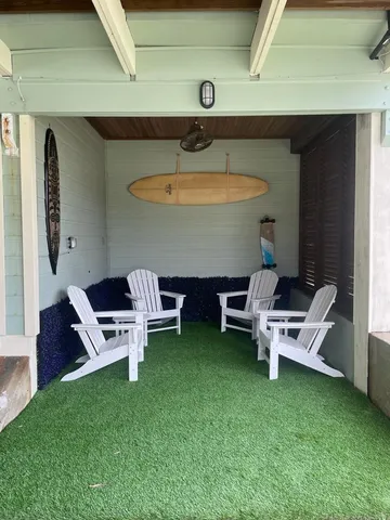 a kitchen with stainless steel appliances kitchen island granite countertop a dining table and chairs