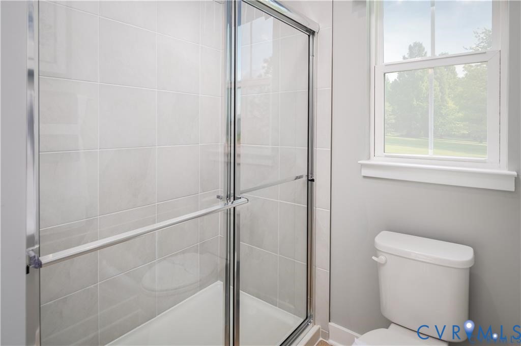 10648 Wrexham Townes View Chesterfield, VA 23832 - Photo 11 of 15 a bathroom with a toilet and a shower