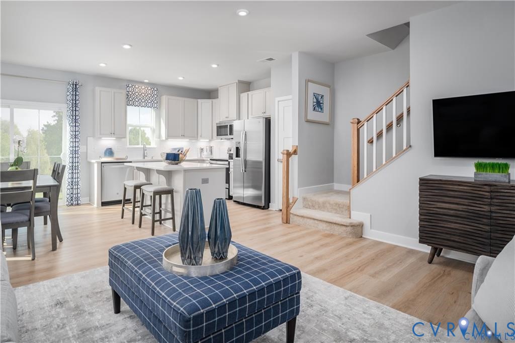10648 Wrexham Townes View Chesterfield, VA 23832 - Photo 4 of 15 a living room with fireplace furniture and a flat screen tv