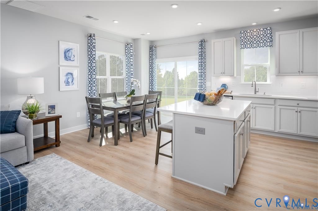 10648 Wrexham Townes View Chesterfield, VA 23832 - Photo 6 of 15 a view of dining table chairs and wooden floor