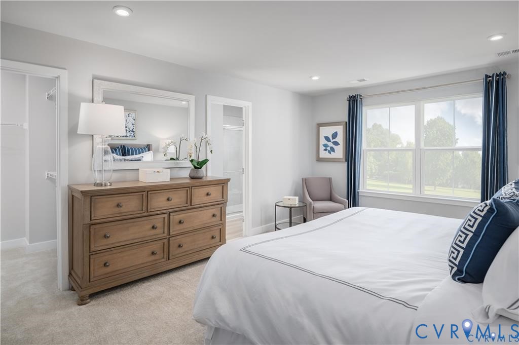 10648 Wrexham Townes View Chesterfield, VA 23832 - Photo 8 of 15 a bedroom with a bed and a dresser