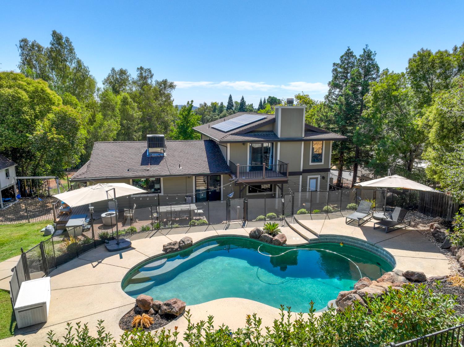 7945 Callison Road Penryn, CA 95663 - Photo 1 of 70 an aerial view of a house with swimming pool garden and patio