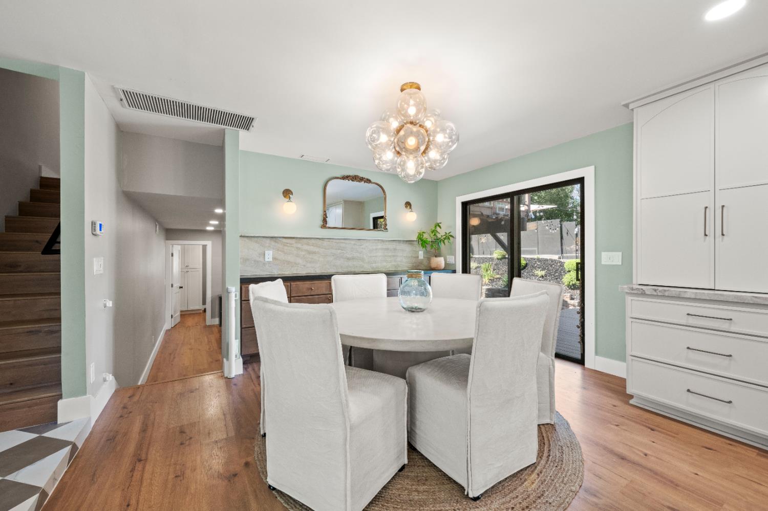 7945 Callison Road Penryn, CA 95663 - Photo 14 of 70 a view of a dining room with furniture a chandelier and wooden floor