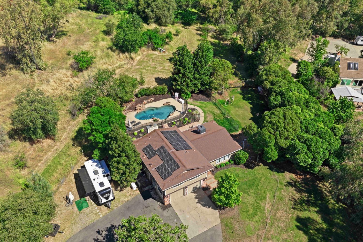 7945 Callison Road Penryn, CA 95663 - Photo 2 of 70 an aerial view of a house with yard swimming pool and outdoor seating
