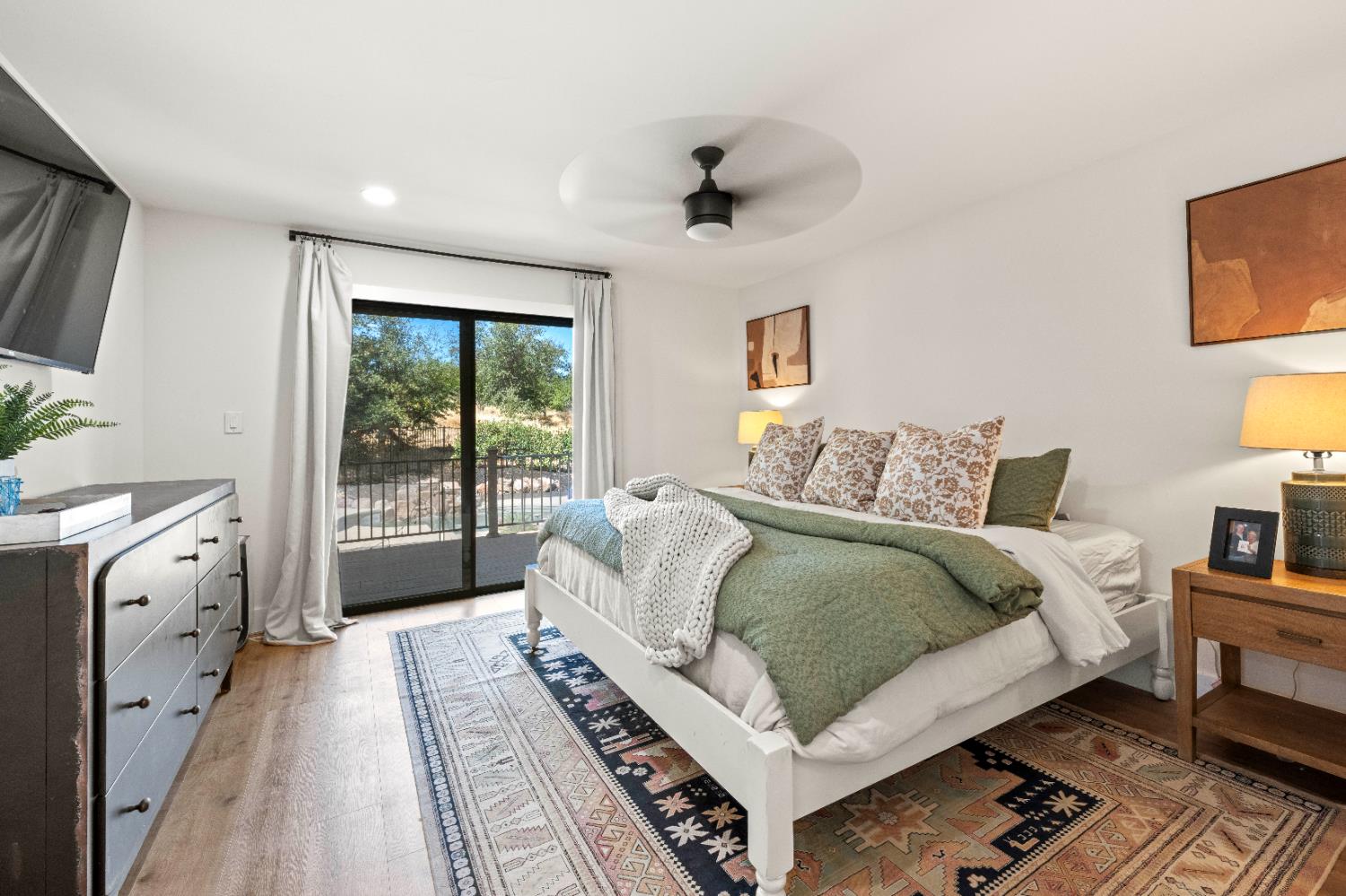 7945 Callison Road Penryn, CA 95663 - Photo 24 of 70 a spacious bedroom with a bed and a large window