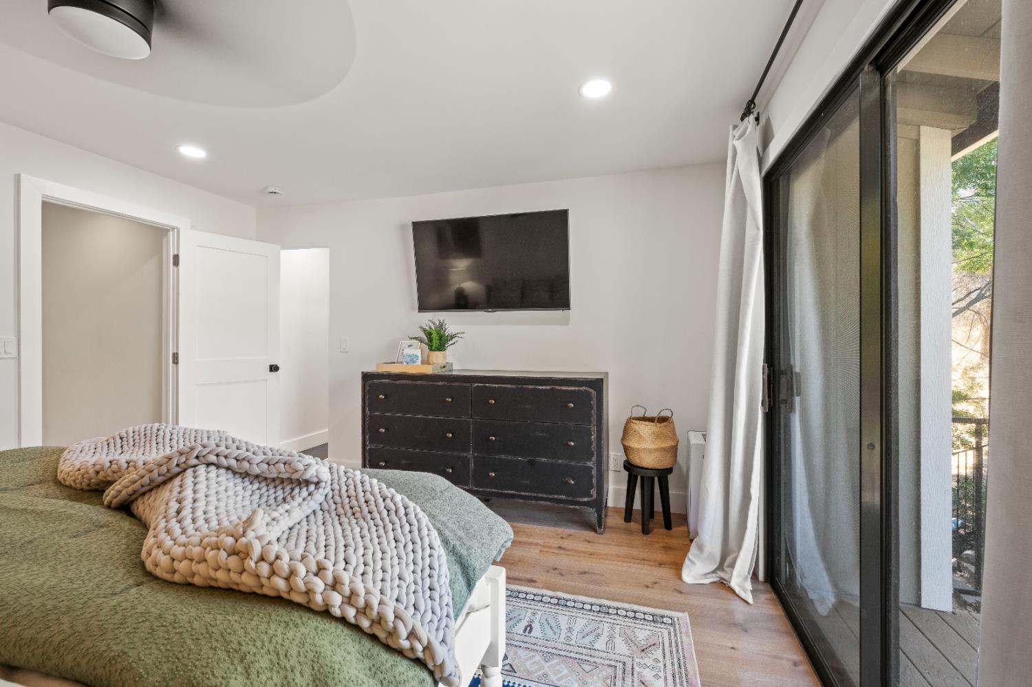 7945 Callison Road Penryn, CA 95663 - Photo 25 of 70 a bedroom with a bed and a flat screen tv