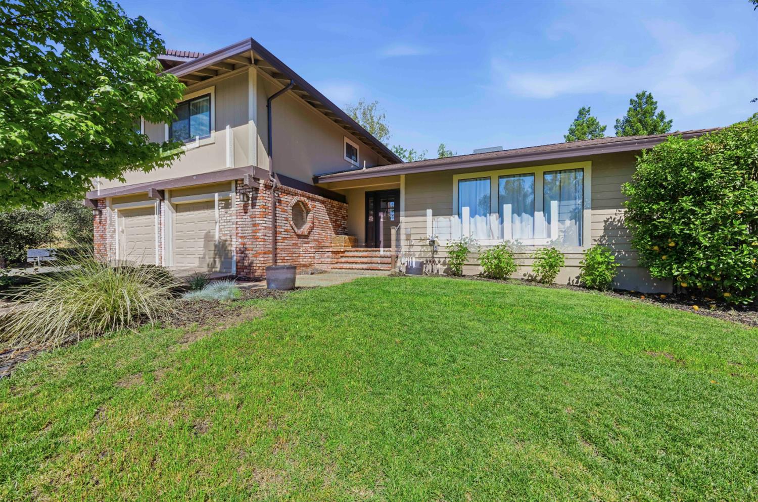 7945 Callison Road Penryn, CA 95663 - Photo 4 of 70 a front view of a house with garden