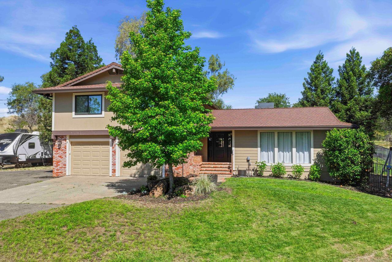7945 Callison Road Penryn, CA 95663 - Photo 5 of 70 a front view of a house with a yard and trees