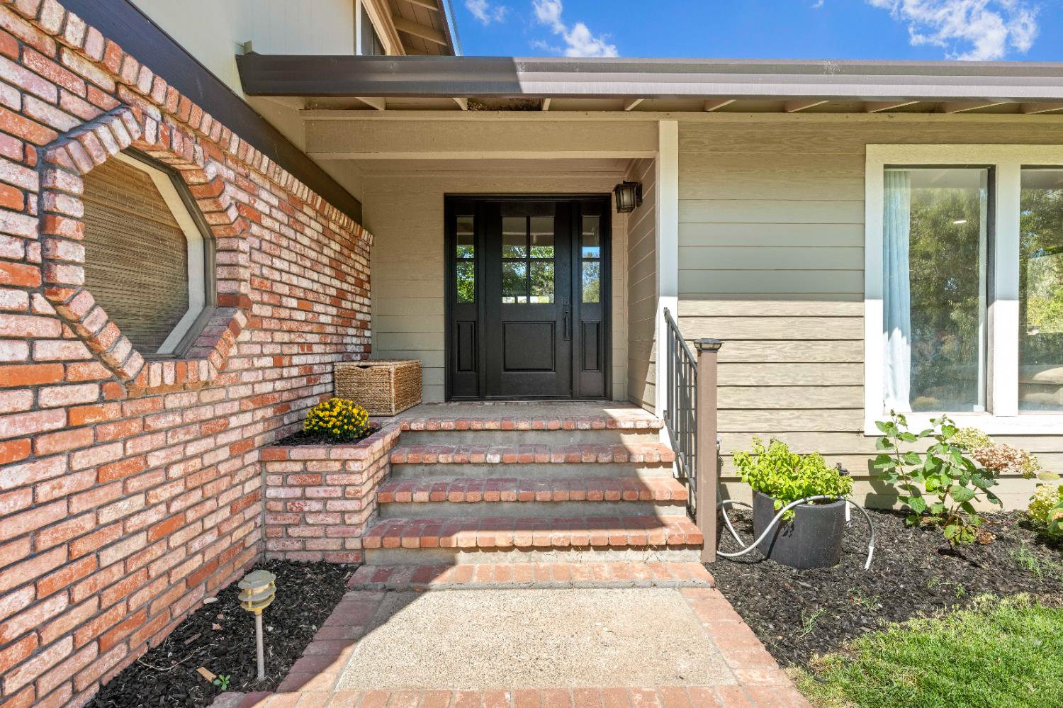 7945 Callison Road Penryn, CA 95663 - Photo 6 of 70 a front view of a house with a garden